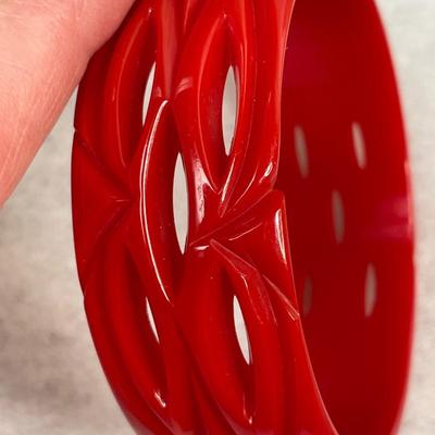 Vintage Cherry Red Carved and Pierced Bakelite bangle bracelet