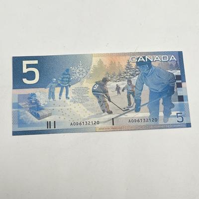 LOT 123J: Canadian Currency - Around 79.84 CAD