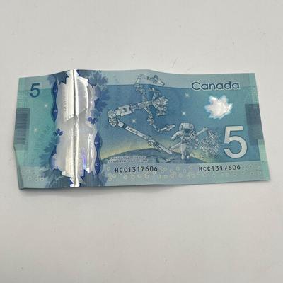 LOT 123J: Canadian Currency - Around 79.84 CAD