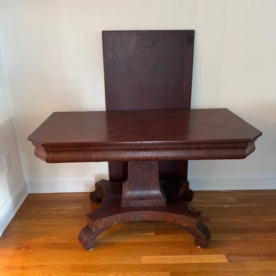 Sale Photo Thumbnail #61: Antique Empire Flip top Game Table. Appears to be mahogany. Flip Top has signs of wear and needs to be reattached.  . Some veneer  on base is also missing due to wear and age. 
48”W x 24”D x 28”H