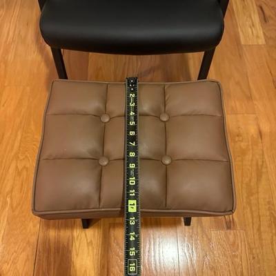Black Chair and Brown Footstool