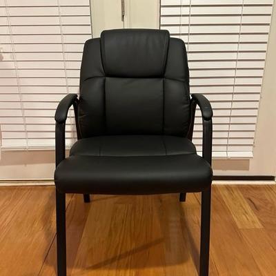 Black Chair and Brown Footstool