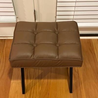Black Chair and Brown Footstool