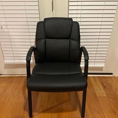 Black Chair and Brown Footstool