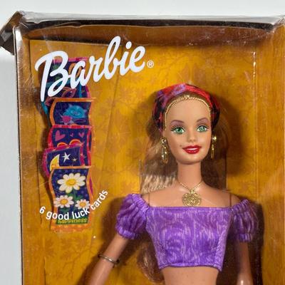 LOT 259: Vintage Holiday/Winter Barbie Collection in Packaging