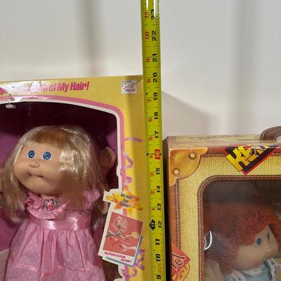 LOT 164: Cabbage Patch Kids Collection - World Traveler, Growing Hair & Young Astronaut in Box