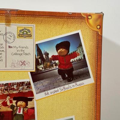 LOT 164: Cabbage Patch Kids Collection - World Traveler, Growing Hair & Young Astronaut in Box