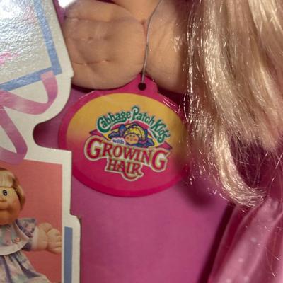 LOT 164: Cabbage Patch Kids Collection - World Traveler, Growing Hair & Young Astronaut in Box