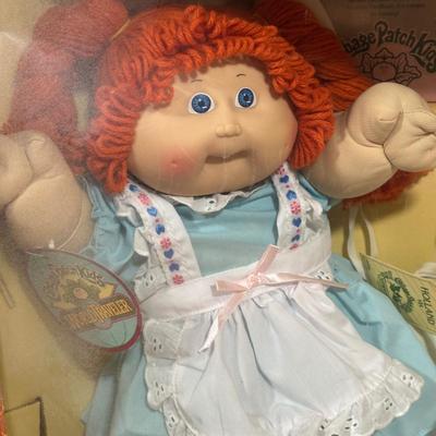 LOT 164: Cabbage Patch Kids Collection - World Traveler, Growing Hair & Young Astronaut in Box