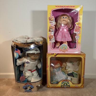 LOT 164: Cabbage Patch Kids Collection - World Traveler, Growing Hair & Young Astronaut in Box