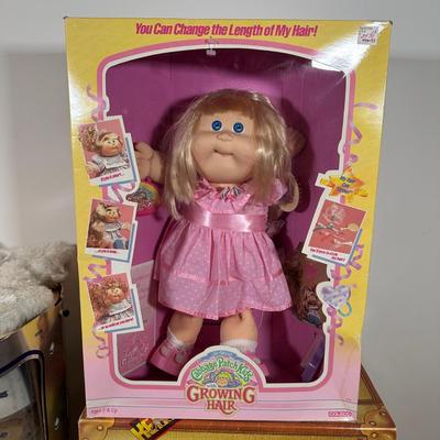 LOT 164: Cabbage Patch Kids Collection - World Traveler, Growing Hair & Young Astronaut in Box
