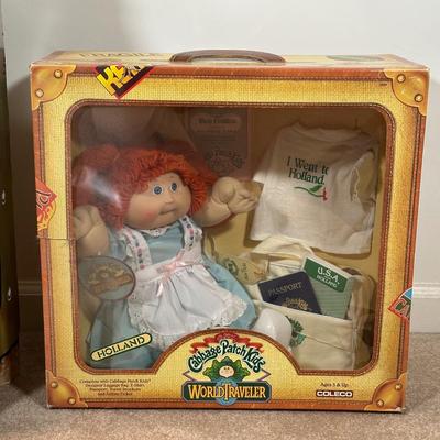 LOT 164: Cabbage Patch Kids Collection - World Traveler, Growing Hair & Young Astronaut in Box