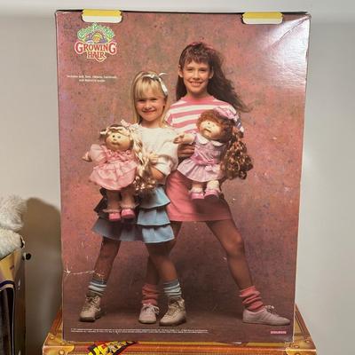 LOT 164: Cabbage Patch Kids Collection - World Traveler, Growing Hair & Young Astronaut in Box