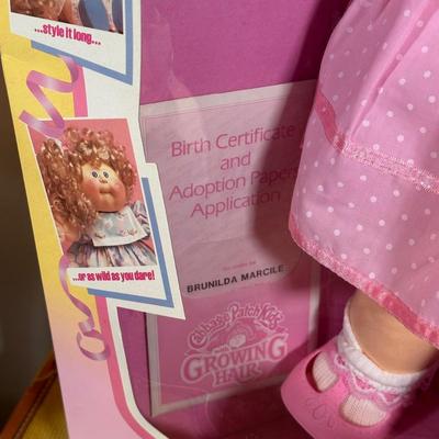 LOT 164: Cabbage Patch Kids Collection - World Traveler, Growing Hair & Young Astronaut in Box