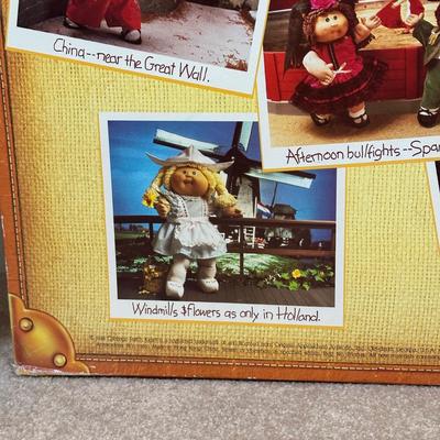 LOT 164: Cabbage Patch Kids Collection - World Traveler, Growing Hair & Young Astronaut in Box