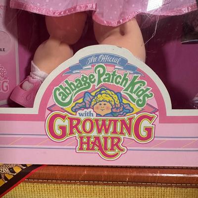 LOT 164: Cabbage Patch Kids Collection - World Traveler, Growing Hair & Young Astronaut in Box