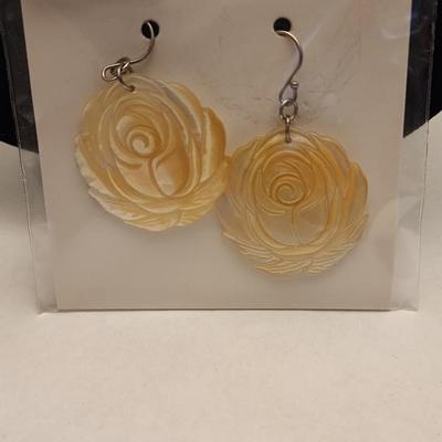 Golden south sea mother of pearl rose earrings.