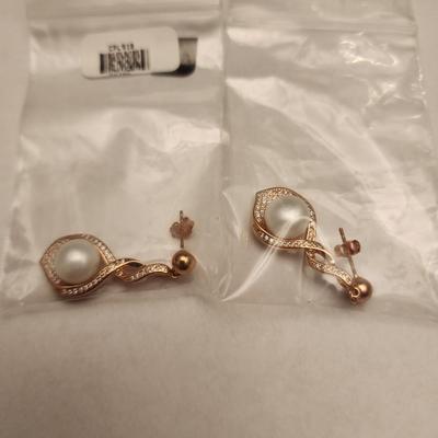 Pair of rose gold/copper toned cultured pearl earrings
