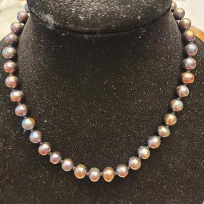 Black iridescent cultured freshwater pearl necklace.