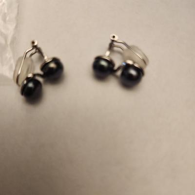 Black freshwater cultured pearl clip on earrings.