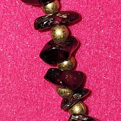 Black and gold stone necklace.