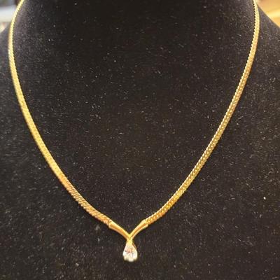 Gold necklace with gem