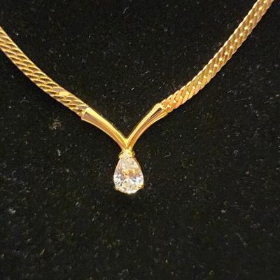 Gold necklace with gem