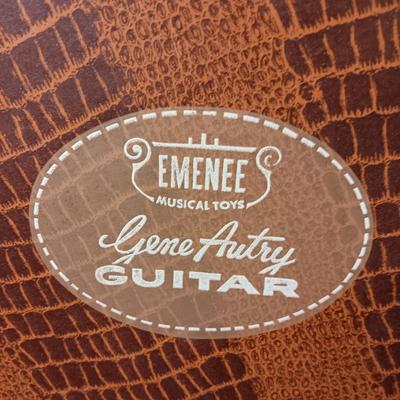 1955 CHILD'S GENE AUTRY BAKELITE GUITAR WITH RAISED DECORATION ON FACE
