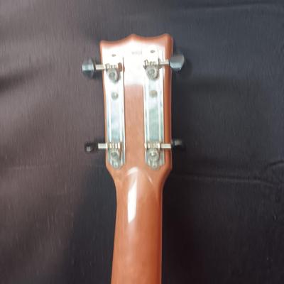 1955 CHILD'S GENE AUTRY BAKELITE GUITAR WITH RAISED DECORATION ON FACE