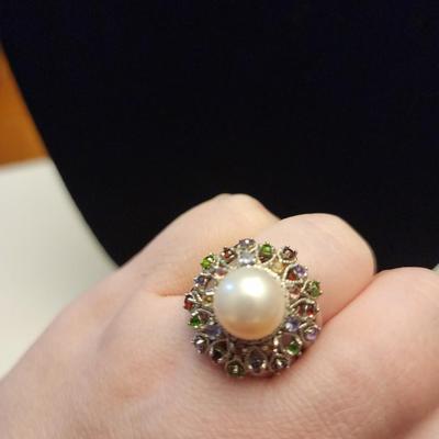Cultured pearl ring with multi jewels surround.