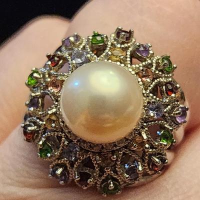 Cultured pearl ring with multi jewels surround.