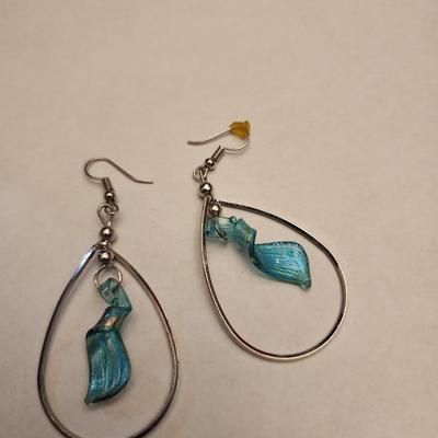 Long beaded necklace with pendant and matching earrings.