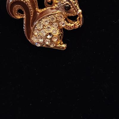 Squirrel necklace.