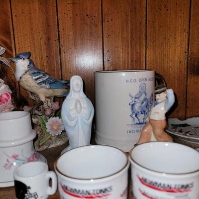 Collection of ceramics in a vintage Samsonite carry on bag