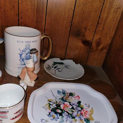 Collection of ceramics in a vintage Samsonite carry on bag