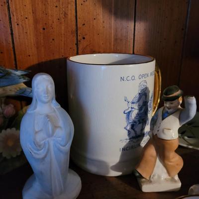 Collection of ceramics in a vintage Samsonite carry on bag