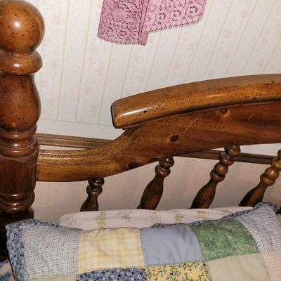 Mid century wooden queen sized bed with handmade quilt