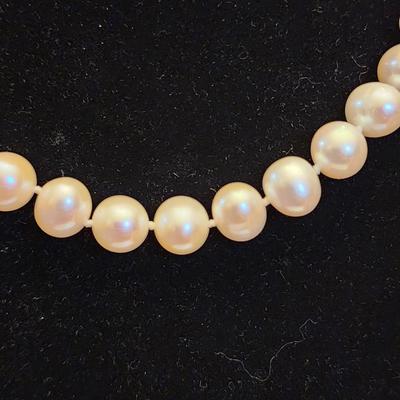 White cultured pearl necklace and earrings set.