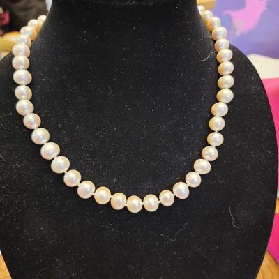 White cultured pearl necklace and earrings set.
