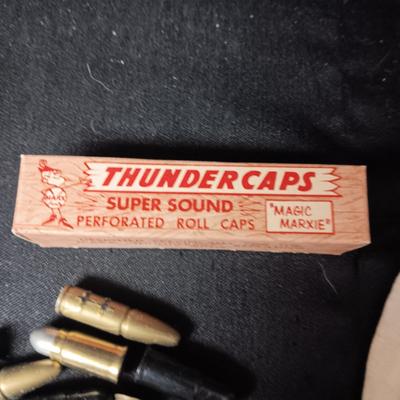 TOY BRASS AND PLASTIC BULLETS AND A BOX OF THUNDERCAPS