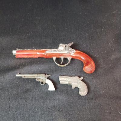 HUBLEY FLINTLOCK JR W/BAKELITE STOCK AND 2 OTHER TOY GUNS