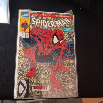 4 COMIC BOOKS IN PROTECTIVE SLEEVES