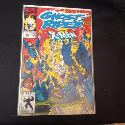 4 COMIC BOOKS IN PROTECTIVE SLEEVES
