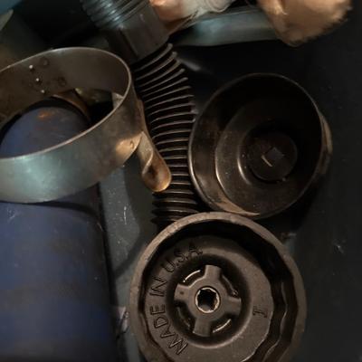 Plastic oil pan, two grease guns two oil filter wrenches and a funnel
