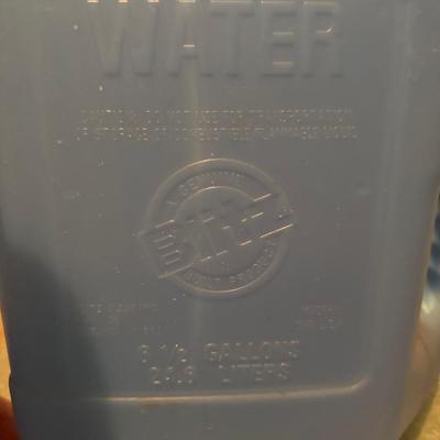 Water cans and 2 gas cans
