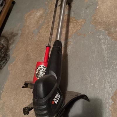 Two weed trimmers