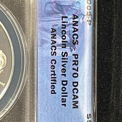 ANACS CERTIFIED 2009-P PROOF-70 DEEP CAMEO LINCOLN COMMEORATIVE SILVER DOLLAR IN A CHERRY WOOD CUSTOM WINDOW BOX.