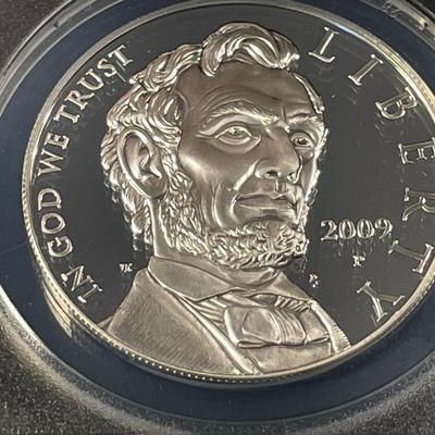ANACS CERTIFIED 2009-P PROOF-70 DEEP CAMEO LINCOLN COMMEORATIVE SILVER DOLLAR IN A CHERRY WOOD CUSTOM WINDOW BOX.