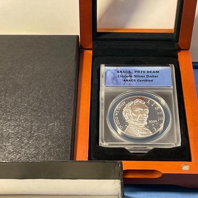 ANACS CERTIFIED 2009-P PROOF-70 DEEP CAMEO LINCOLN COMMEORATIVE SILVER DOLLAR IN A CHERRY WOOD CUSTOM WINDOW BOX.