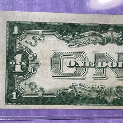 SERIES OF 1928 CRISP AU/UNCIRCULATED "FUNNY BACK" SILVER CERTIFICATE AS PICTURED. FREE DOMESTIC SHIPPING.